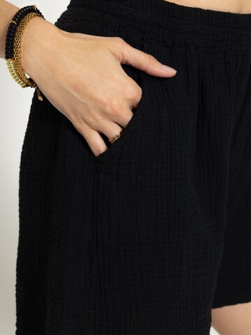 SASSYCLASSY Loose fit Trousers in Black