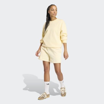 ADIDAS ORIGINALS Loose fit Pants 'Essential' in Yellow