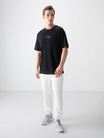 Tommy Life T-Shirts in Schwarz