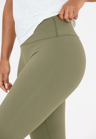 Athlecia Skinny Sports trousers 'Luxe V2' in Green