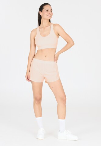 Athlecia Regular Workout Pants 'Alain' in Beige