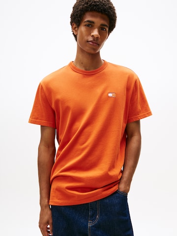Tricou de la Tommy Jeans pe portocaliu: față
