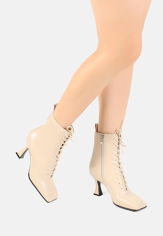 Ekonika Lace-Up Ankle Boots in Beige: front