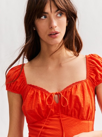 Next Zomerjurk in Rood