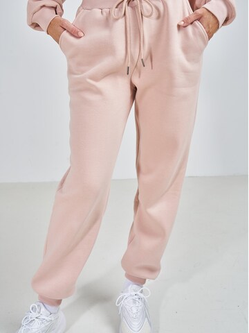 ABOUT YOU x Swalina&Linus Loose fit Trousers 'Luisa' in Pink: front