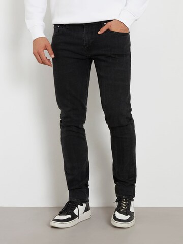 GUESS Slimfit Jeans in Schwarz: predná strana