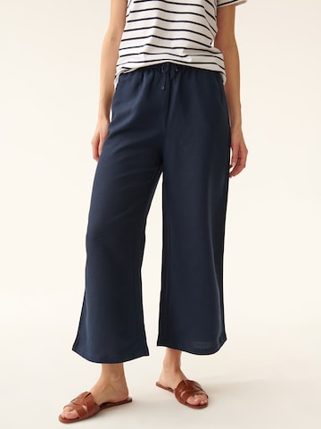 TATUUM - Perna larga Calças em azul: frente