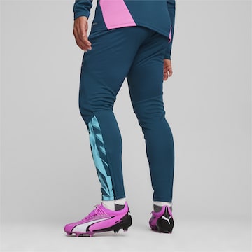 PUMA Skinny Športne hlače 'Individual Final' | modra barva
