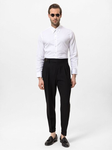 Antioch Tapered Pleat-front trousers in Black