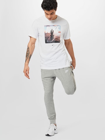 Nike Sportswear Tapered Housut värissä harmaa