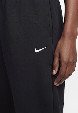 Nike Sportswear - Pierna ancha Pantalón 'Studio' en negro