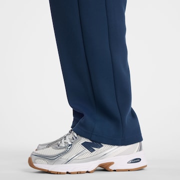 new balance - Regular Calças de desporto 'Post Season' em azul