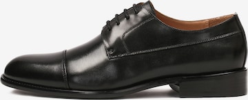 Kazar Lace-Up Shoes in Black: front