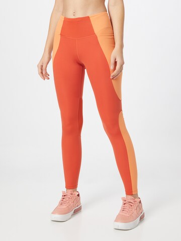 NIKE Skinny Sports trousers in Orange: front