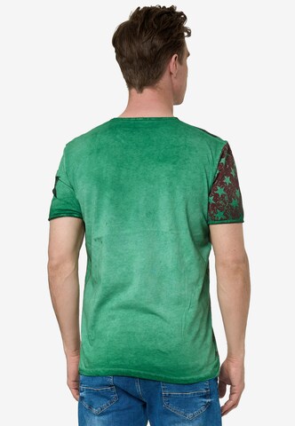 Rusty Neal Cooles T-Shirt mit V-Ausschnitt in Grün