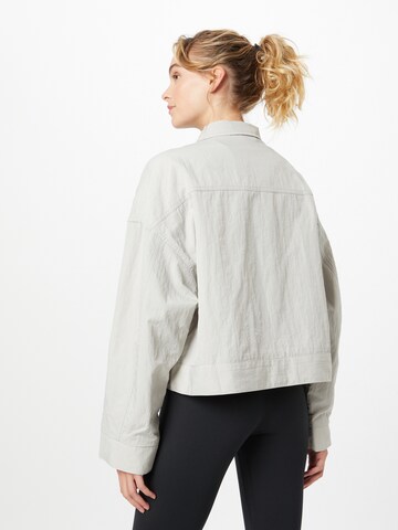 Nike Sportswear Between-season jacket 'FIELD' in Grey