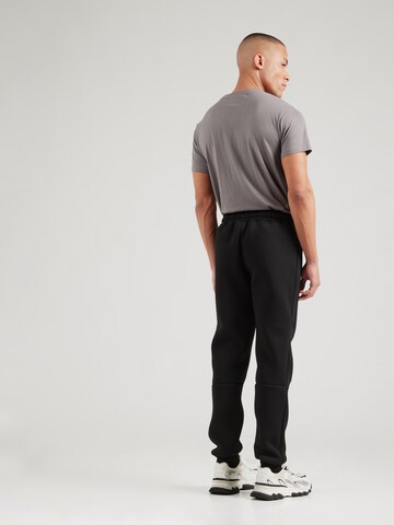 ELLESSE - Tapered Pantalón 'Latoso' en negro