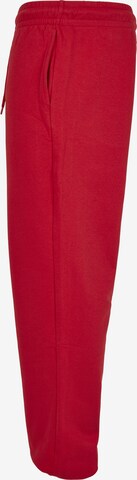 Tapered Pantaloni di Urban Classics in rosso