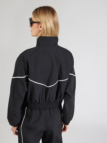 Veste mi-saison 'SPEED' Nike Sportswear en noir