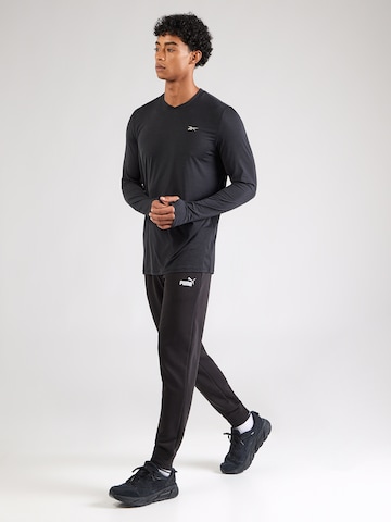 PUMA Tapered Urheiluhousut 'ESS No. 1' värissä musta