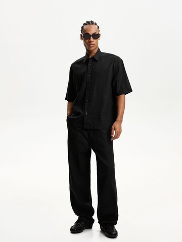 Wide leg Pantaloni di Bershka in nero