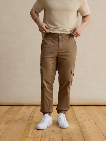 DAN FOX APPAREL Tapered Trousers 'Damon' in Beige: front