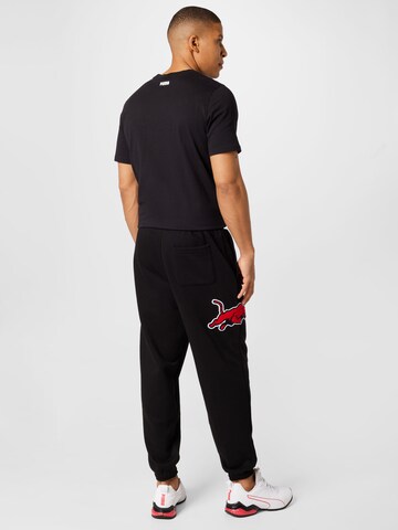 PUMA Zwężany krój Spodnie sportowe w kolorze czarny