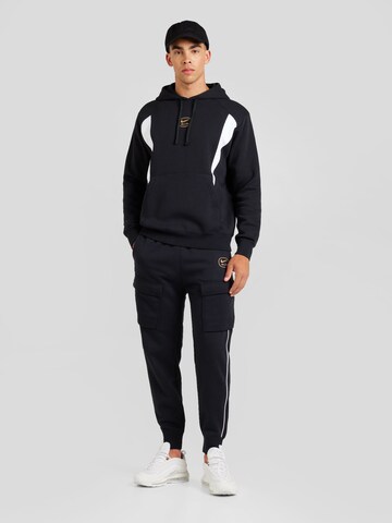 Nike Sportswear Zwężany krój Bojówki 'AIR' w kolorze czarny