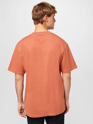 Maglietta di Karl Kani in arancione