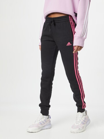 ADIDAS SPORTSWEAR Tapered Sportbroek 'Essentials Fleece 3-Stripes' in Zwart: voorkant