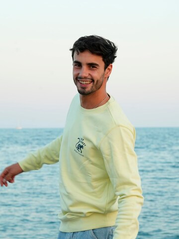 Surf Monkey - Sudadera 'Rette das Ozean' en amarillo