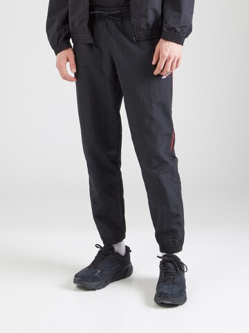 Reebok Tapered Sports trousers in Black: front