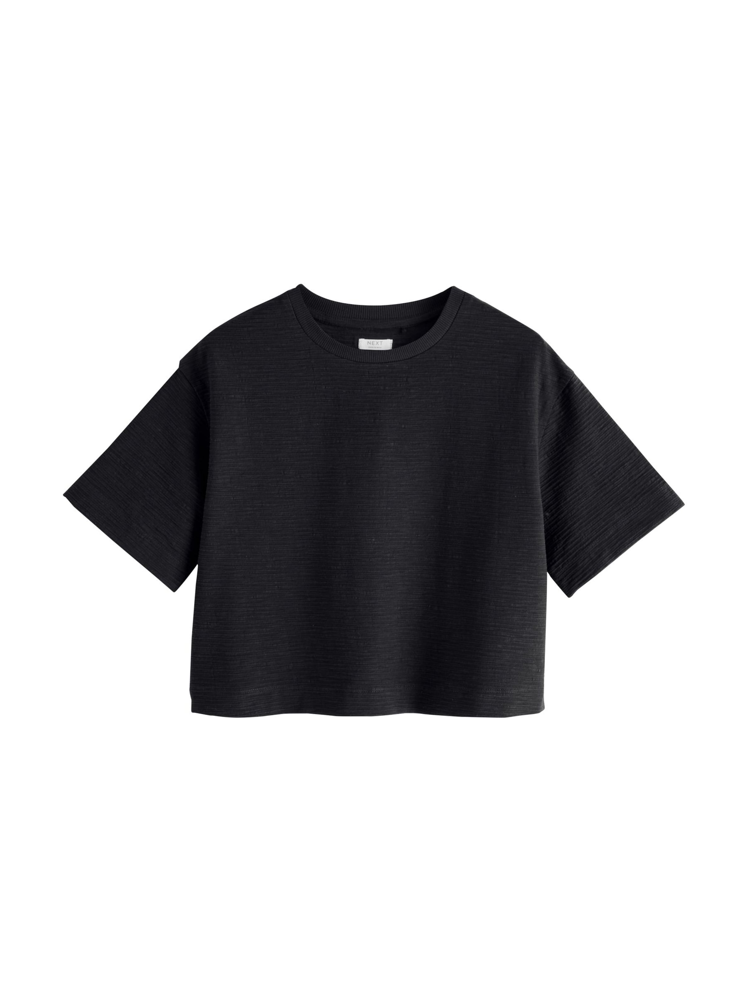 Next T-shirt i svart: framsida