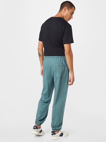 Loosefit Pantalon Urban Classics en bleu