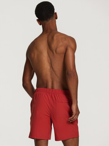 Shiwi Board Shorts 'easy mike solid 4-way stretch' in Rot