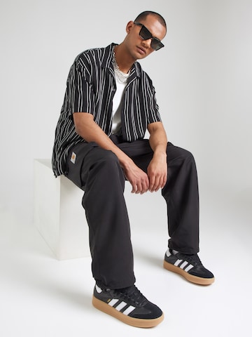 Tapered Pantaloni cargo 'Irwin' di Carhartt WIP in nero