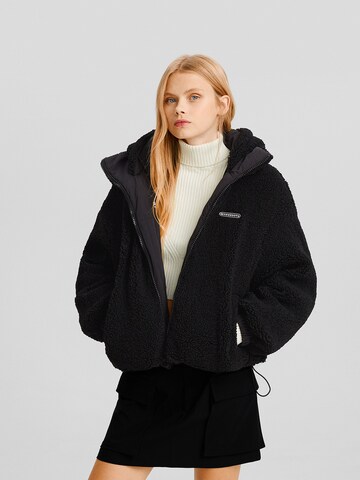 Bershka Winter Jacket in Black: front