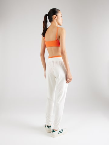 ELLESSE - Slimfit Pantalón en blanco