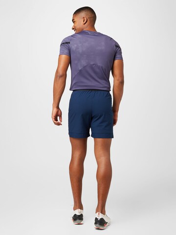 UNDER ARMOUR Normalny krój Spodnie sportowe 'Vanish' w kolorze niebieski