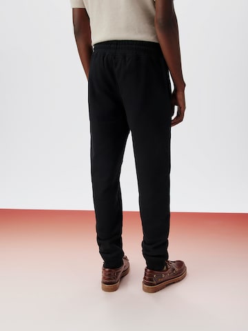 ABOUT YOU x Kingsley Coman Tapered Broek 'Lio' in Zwart