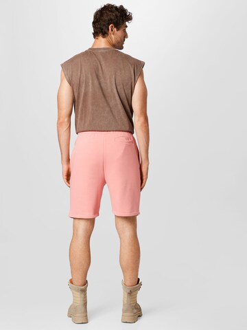 Karl Kani Regular Shorts in Pink