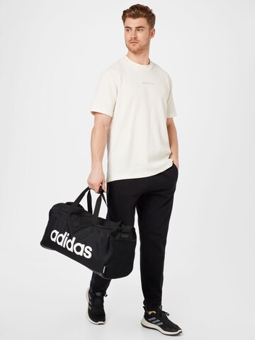 ADIDAS ORIGINALS Tapered Broek 'Graphics Camo Sweat' in Zwart