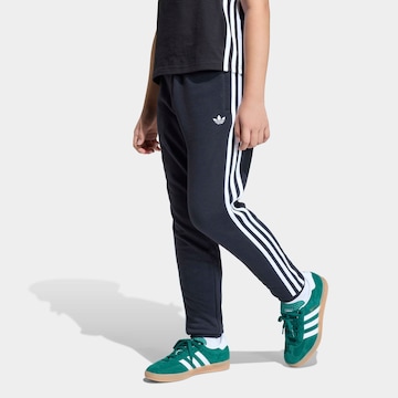 ADIDAS ORIGINALS Tapered Pants in Black: front