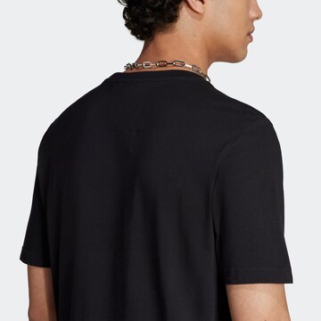 ADIDAS ORIGINALS Shirt 'Graphics Camo Tongue Label' in Schwarz