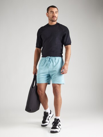 Regular Pantaloni 'CLUB FLOW' de la Nike Sportswear pe albastru