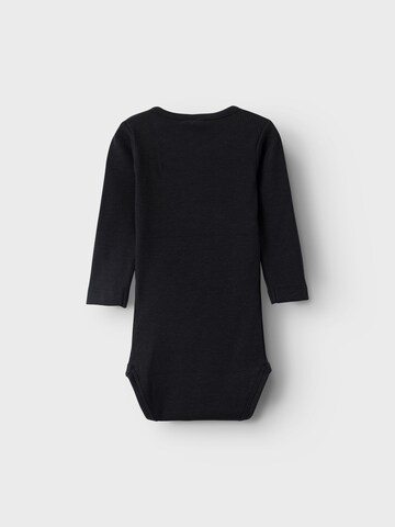 NAME IT - Pijama entero/body 'KAB' en negro