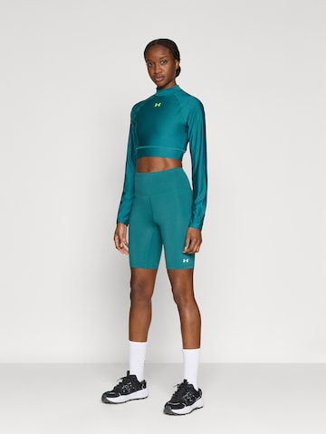 Skinny Pantaloni sportivi 'Motion' di UNDER ARMOUR in verde