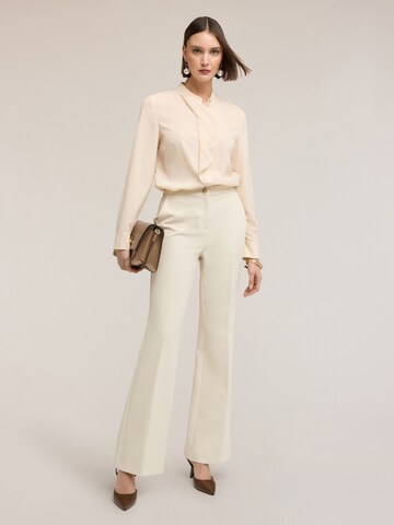 MOTIVI Flared Trousers in White