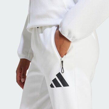 Tapered Pantaloni sportivi 'Z.N.E.' di ADIDAS SPORTSWEAR in bianco