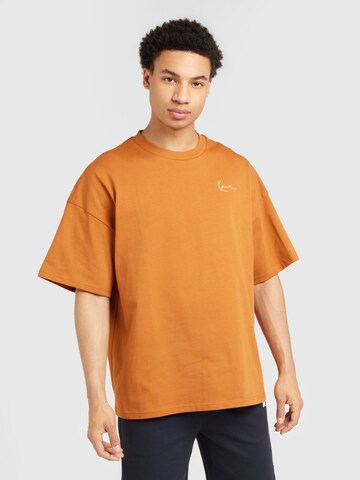 T-Shirt Karl Kani en orange : devant